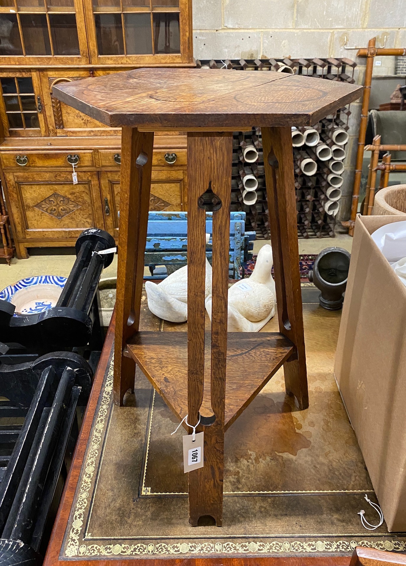 A Liberty style hexagonal oak occasional table, width 39cm, height 71cm